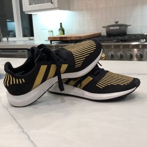 Black and Gold Adidas tennis shoes
